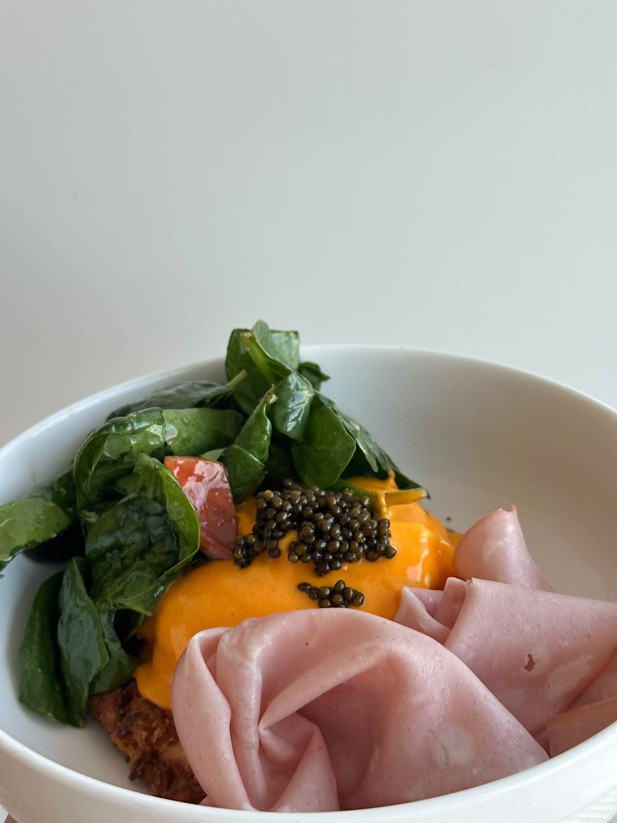 Eggs benedict with ham, spinach and oscietra caviar