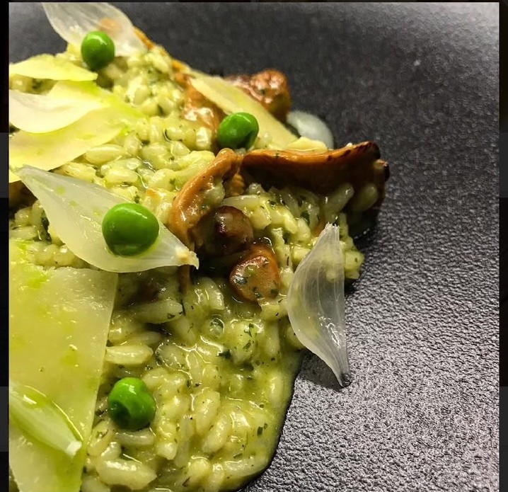 Creamy risotto with wild mushrooms, peas and parmesan