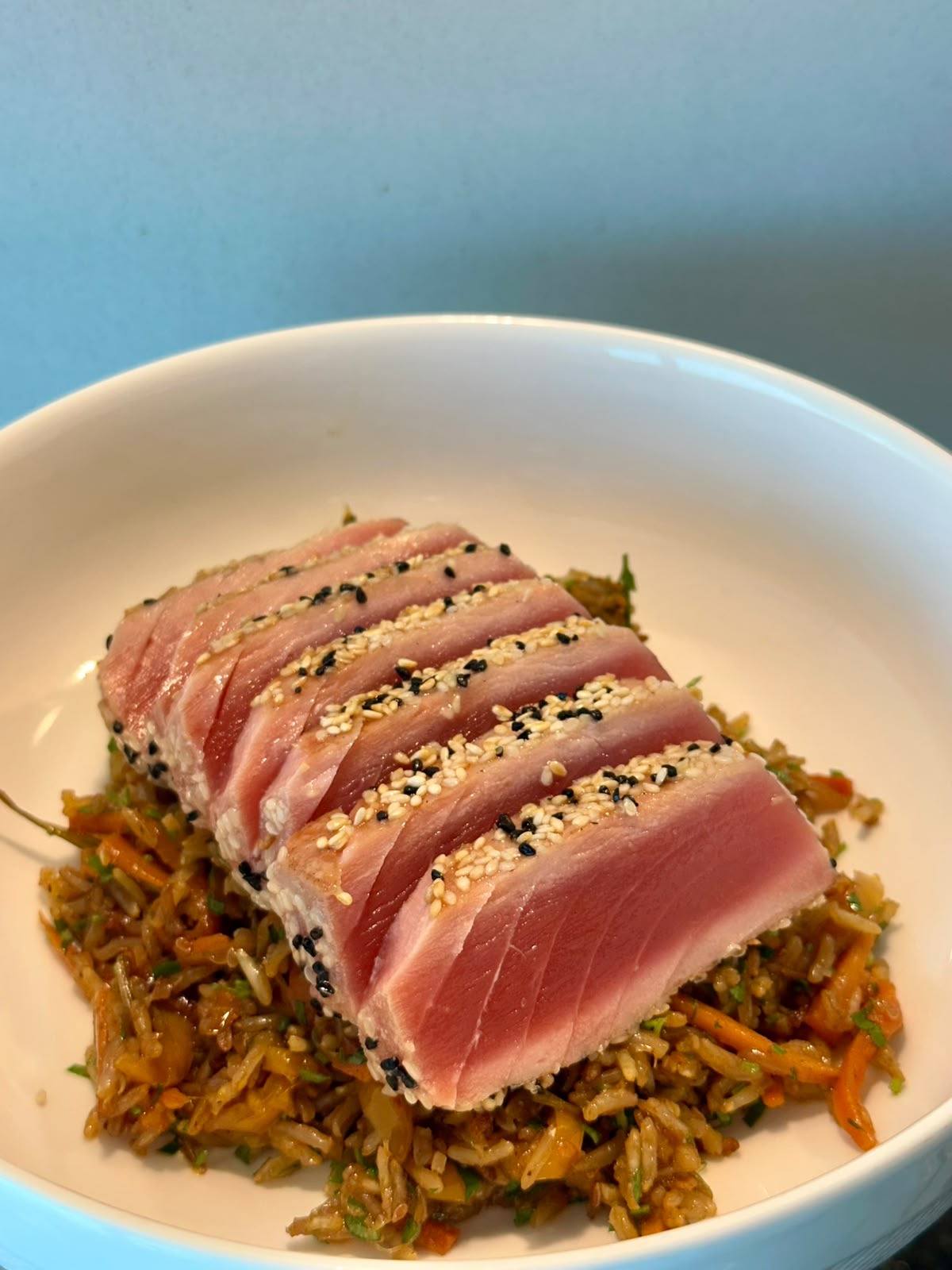 Sesame-crusted tuna tataki over vegetable rice