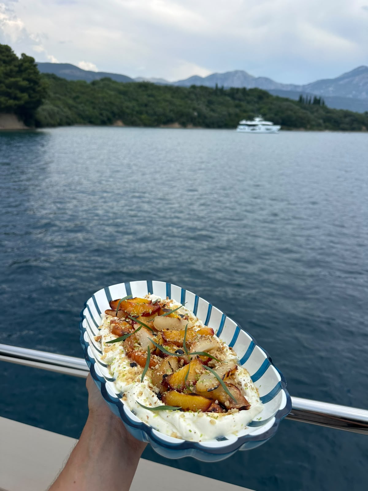 Grilled peach dessert served on a yacht at anchor